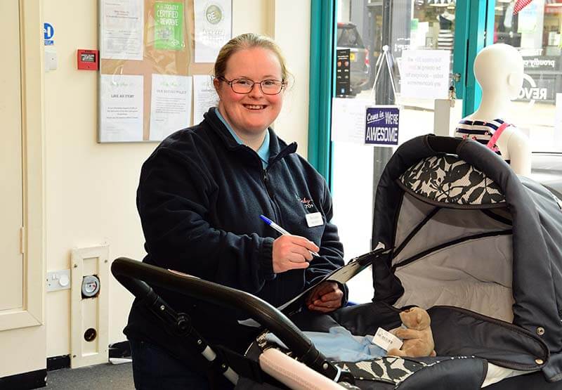 Marianne from Baby Steps 20+ checking over a pram for reuse