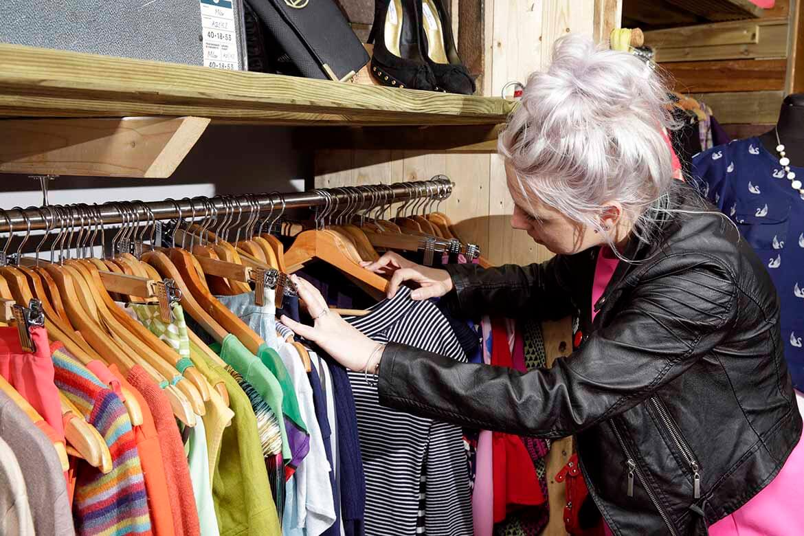 Photo of person browsing in a second hand shop